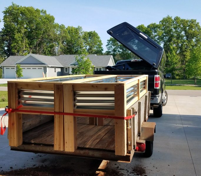 a truck with loaded garden beds for delivery